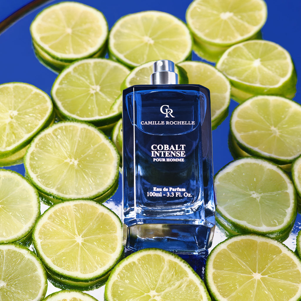 Cobalt Intense Eau de Parfum 3.4 oz resting among limes