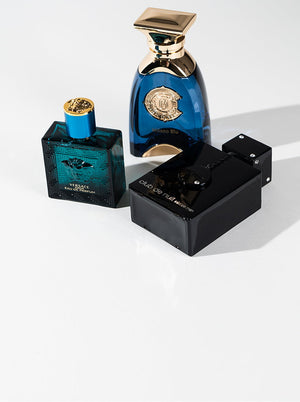 Versace Eros, Milano Blu, and Club de Nuit Intense Man colognes on a white backdrop, showcasing top men's fragrance bestsellers.