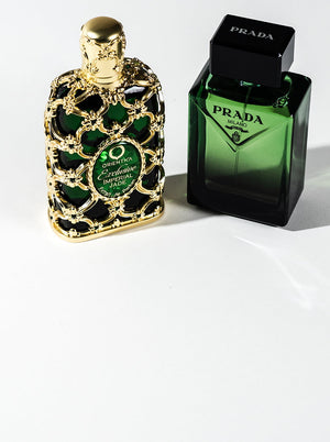 Two green luxury perfume bottles — Orientica Exclusive Imperial Jade and Prada Milano on a white background, showcasing new fragrance arrivals.