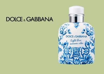 Dolce & Gabbana Light Blue Summer Vibes in a ceramic-inspired white and blue bottle, placed on a soft green background with elegant brand lettering. 5