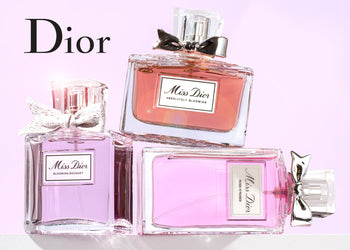 Dior Miss Dior perfume bottles in soft pink tones arranged on a white surface with a pastel background and elegant lighting. 3