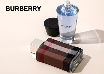 Burberry Touch for Men and Burberry plaid bottle displayed on a soft ivory surface with the Burberry logo. 5