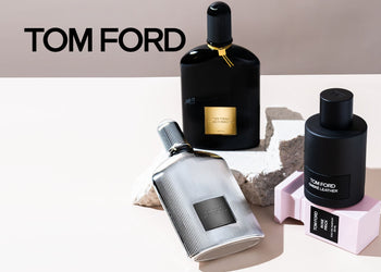 Tom Ford fragrance bottles including Black Orchid, Ombré Leather, and Rose Prick displayed on a minimalist surface with neutral tones and soft lighting. 4